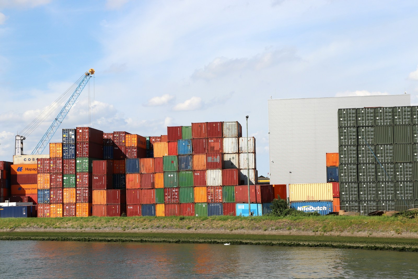 A body of water with a bunch of containers on top of it