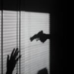 silhouette of person on window