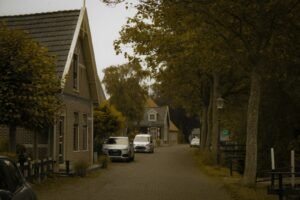 two cars parked on the side of a road