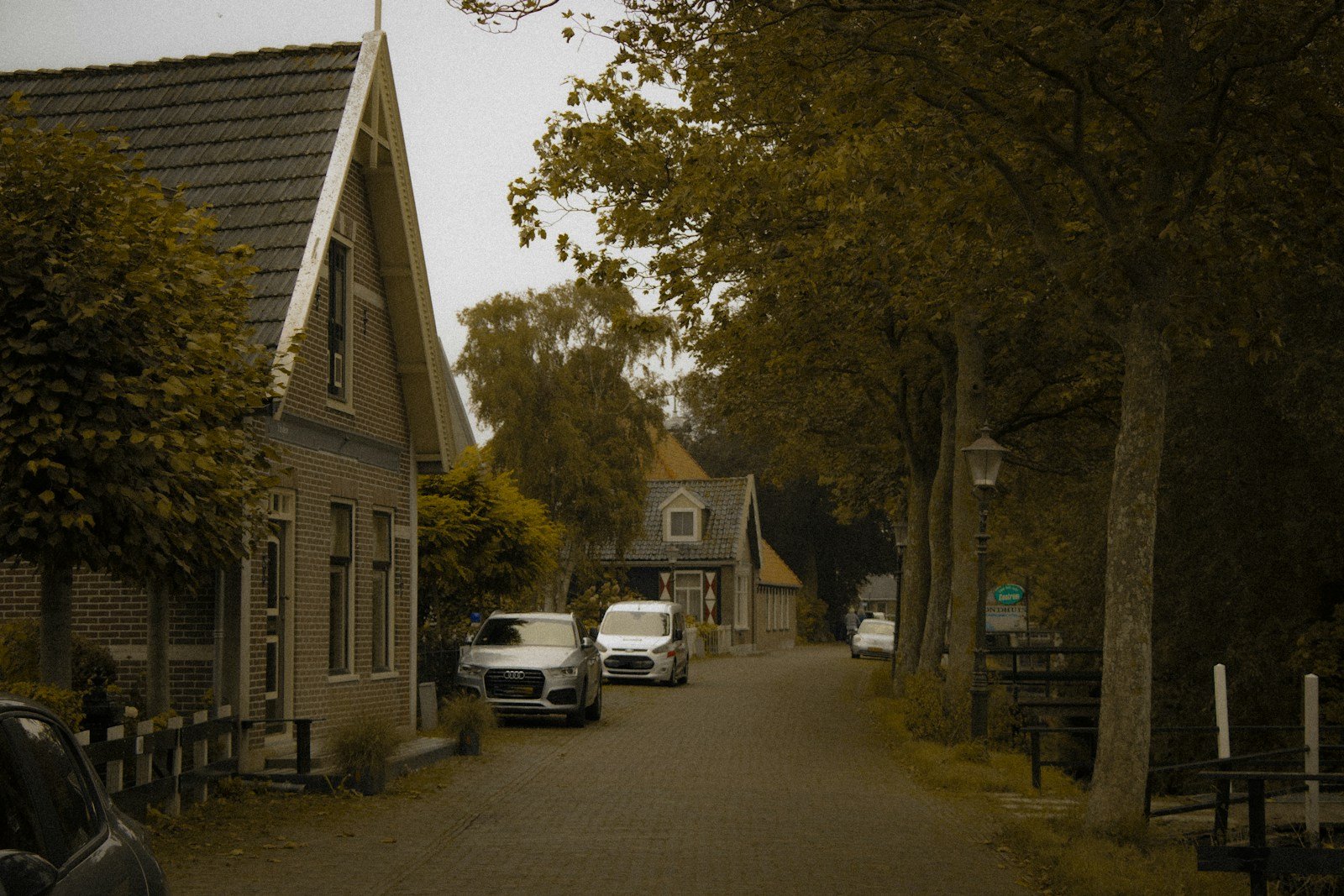 two cars parked on the side of a road