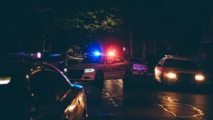 A couple of police cars parked in a parking lot