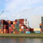 A body of water with a bunch of containers on top of it