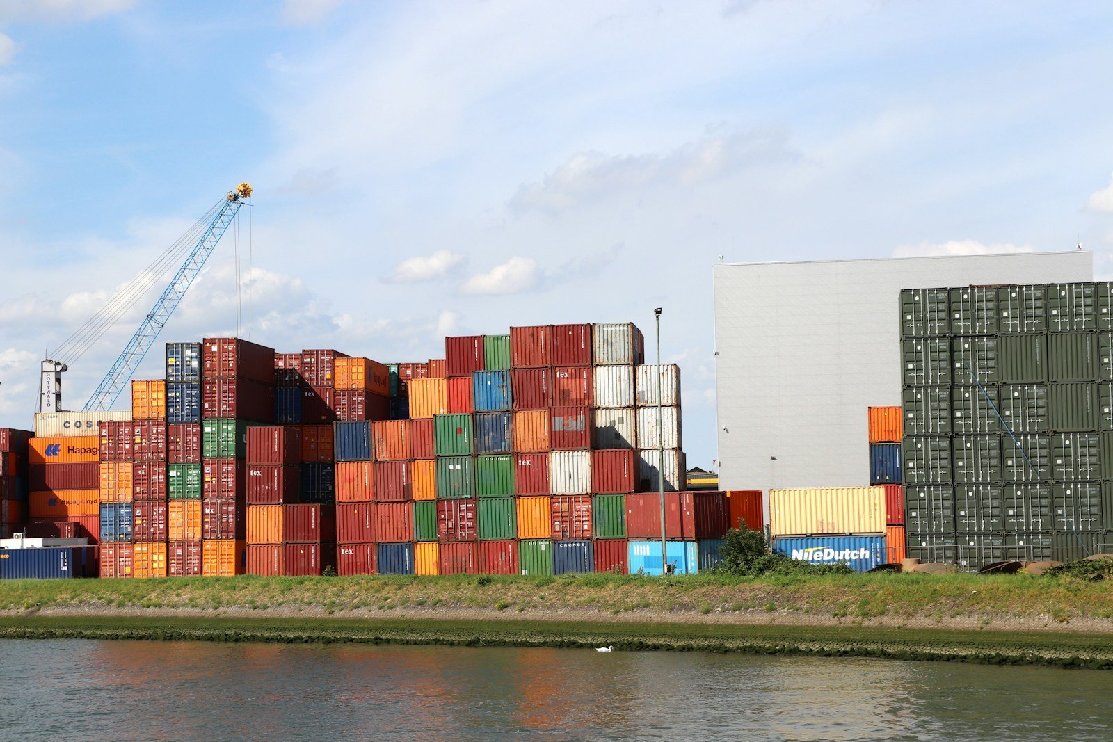 A body of water with a bunch of containers on top of it
